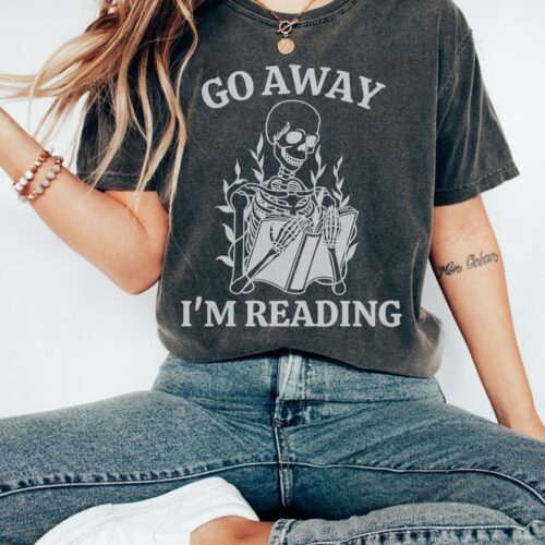 Go Away I'm Reading Skeleton Fall Death By TBR Bookish Halloween Shirt image 0